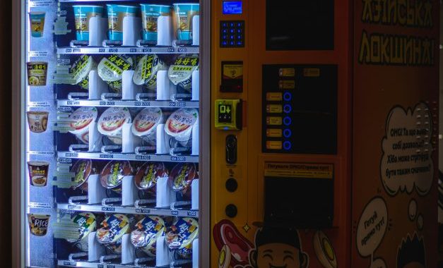 a vending machine with a lot of food inside of it